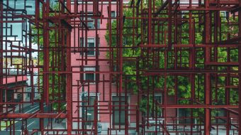 Pink apartment building behind a grid of brown metal beams.